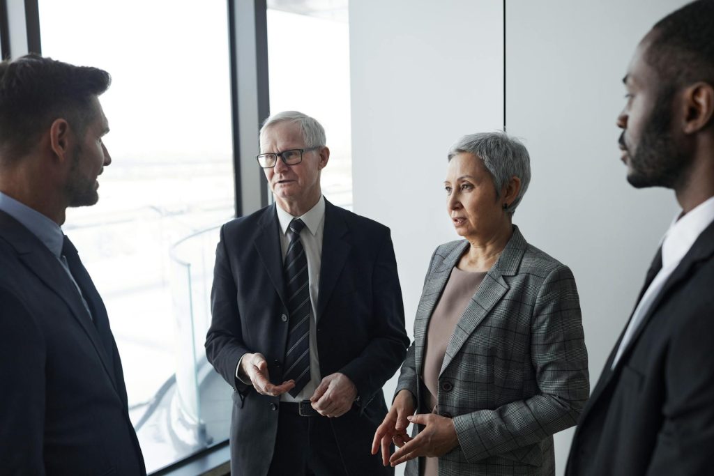 A group of people talking in a room