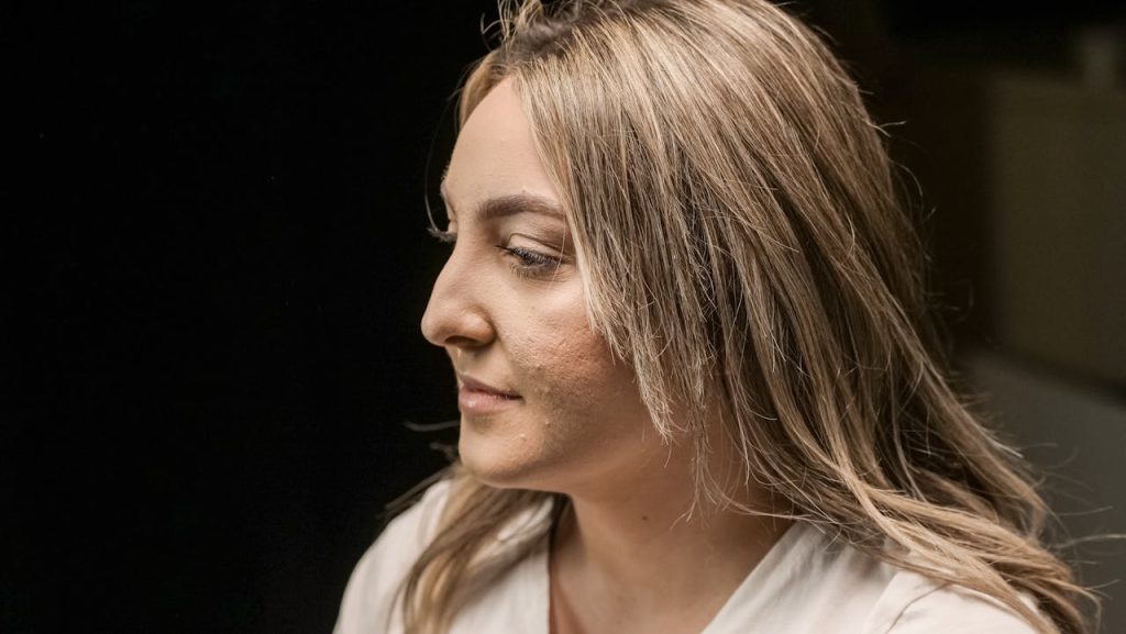 Side view photo of a woman